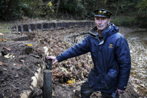 Chair of Saltburn Miniature Railway Robert Proctor and the new flood defence system. 